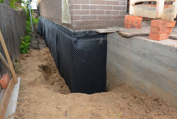 SJ Waterproofing Pros technician performing targeted Emergency Waterproofing assessment in Homer, MI